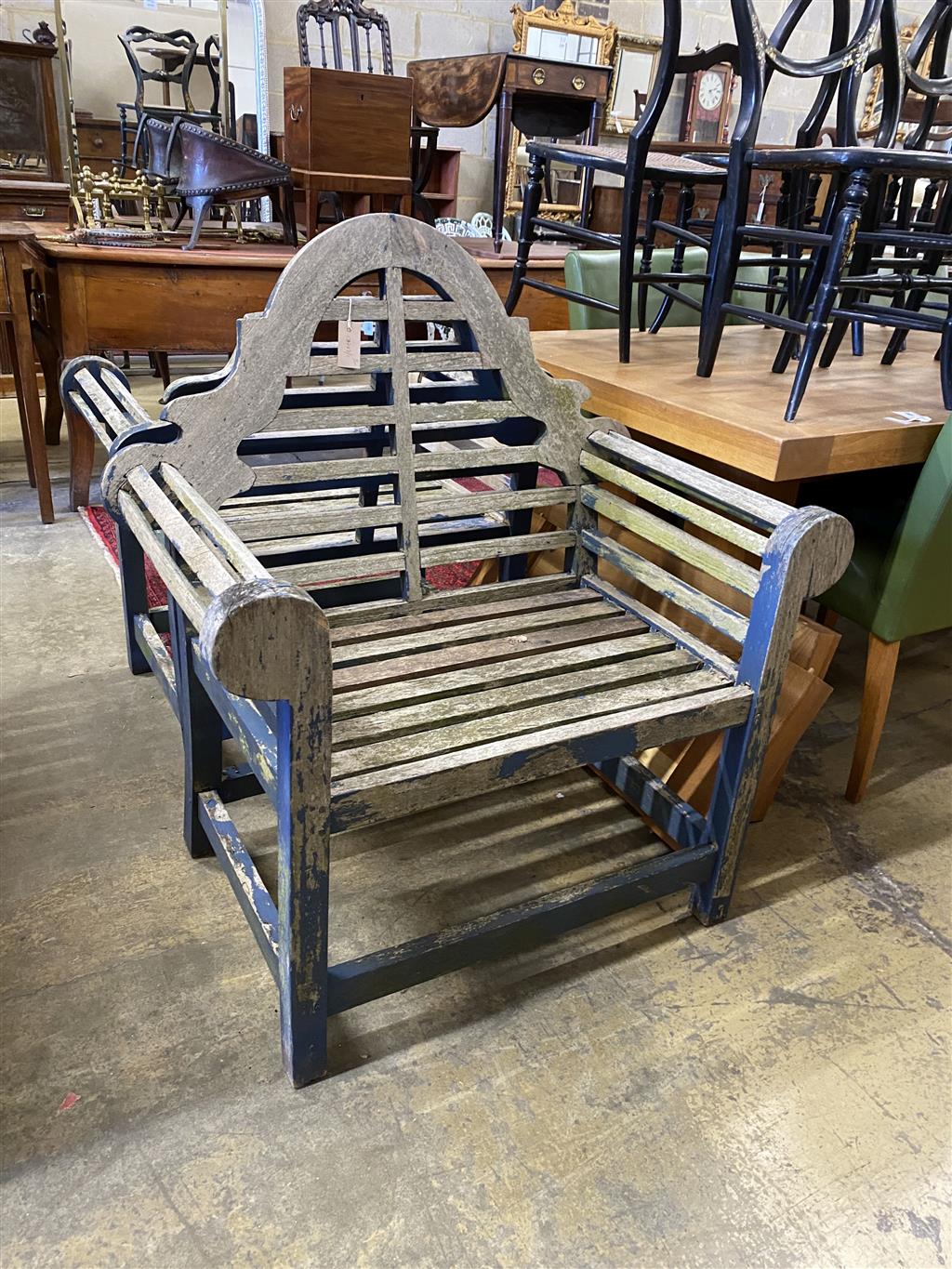 A pair of Lutyens style weathered teak garden chairs, width 94cm, depth 62cm, height 104cm